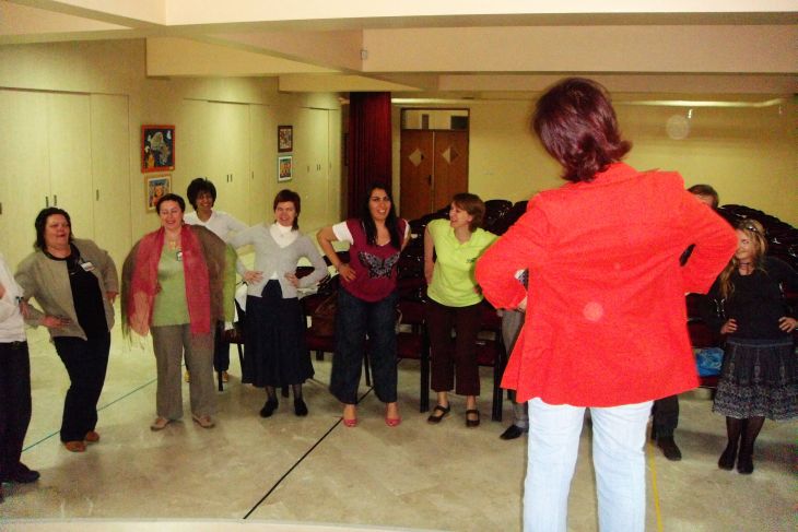 adults gesturing in  lesson