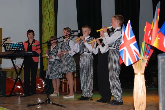 row of smart flute player boys