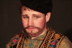 language-theatre boy with beard and costume